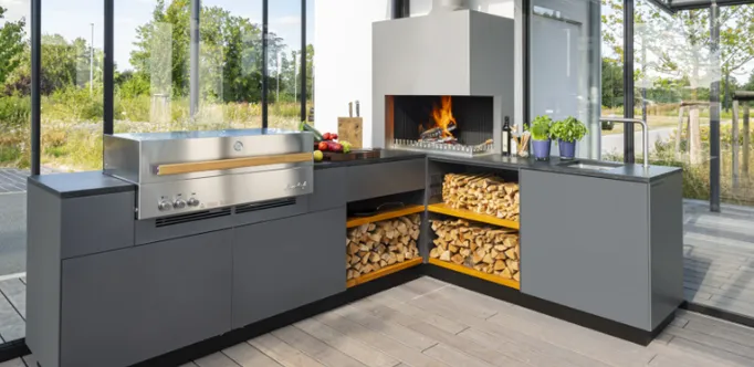 Luxurious Flammkraft outdoor kitchen in a conservatory with glass walls